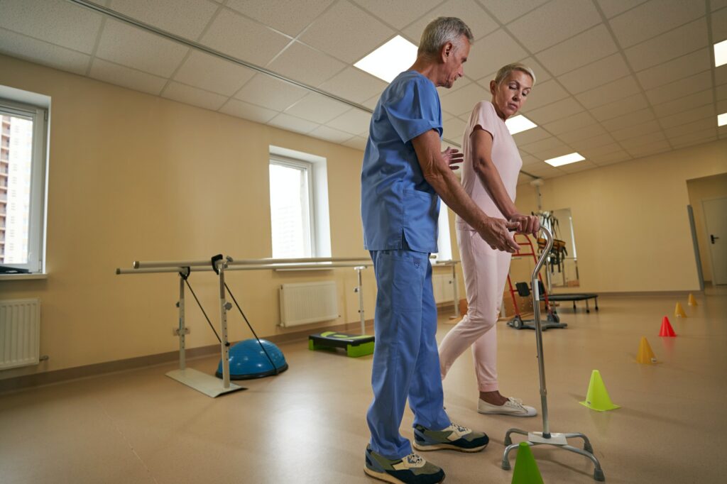 Stroke patient restoring movement skills in rehab center